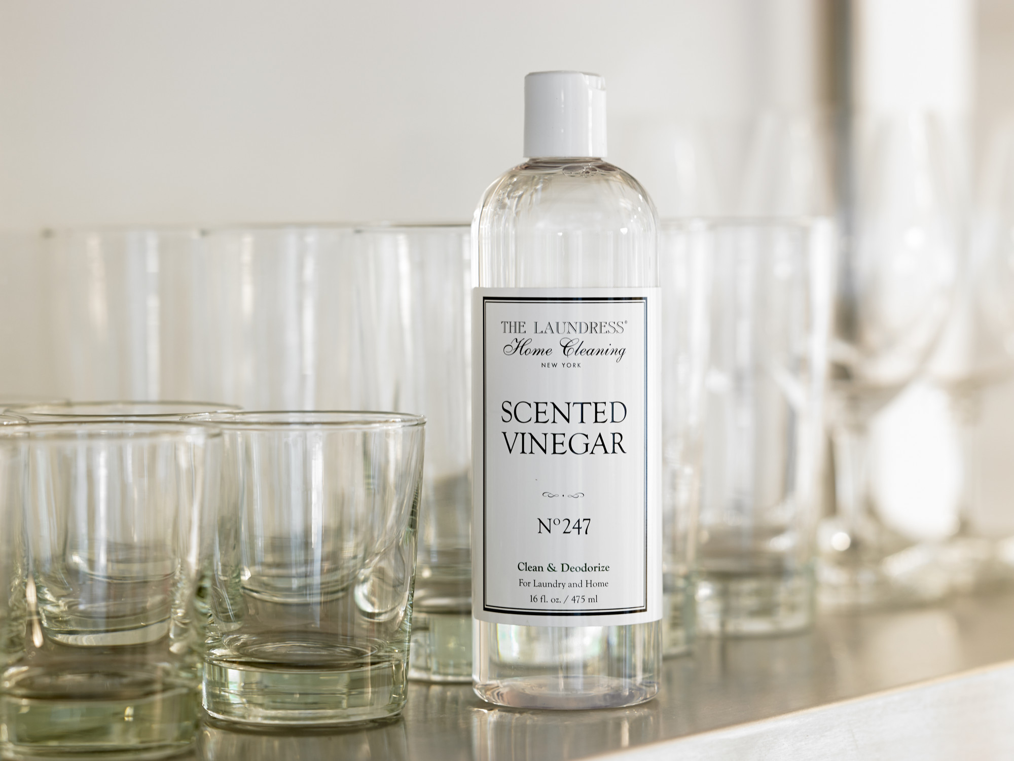 scented vinegar in front of glass cups