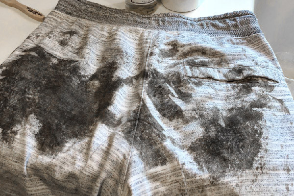 black mud on sweatpants
