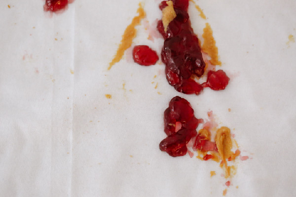 jam stain on white sheet
