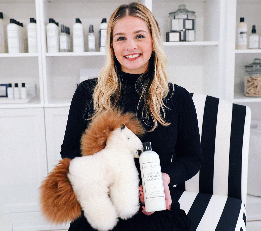brianna holding a stuffed animal and the wool and cashmere shampoo